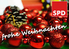 rote Weihnachtskugeln mit Tannenzapfen als Kranz mit Beschriftung: SPD - frohe Weihnachten